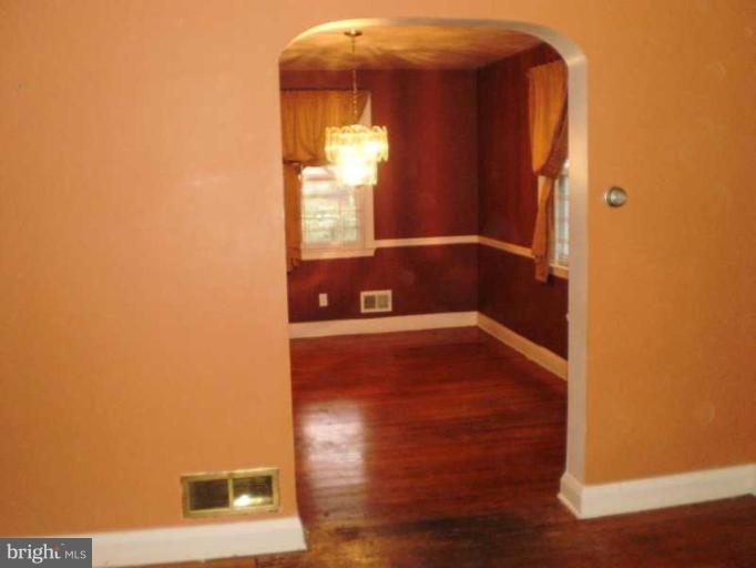443 South Wickham Road Baltimore, MD 21229 - Photo 3 of 9 a view of a hallway with wooden floor