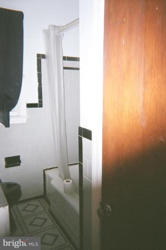 443 South Wickham Road Baltimore, MD 21229 - Photo 7 of 9 a bathroom with sink and mirror