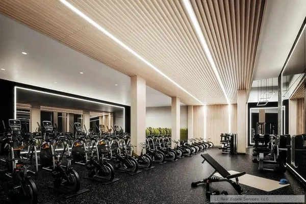 a room with gym equipment and a large window