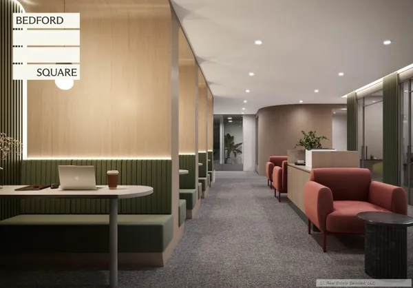 a lobby with furniture and a table