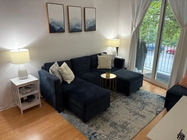 a living room with furniture and a window
