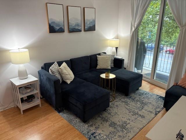9971 Shore Road, Unit 9C Brooklyn, NY 11209 - Photo 4 of 9 a living room with furniture and a window