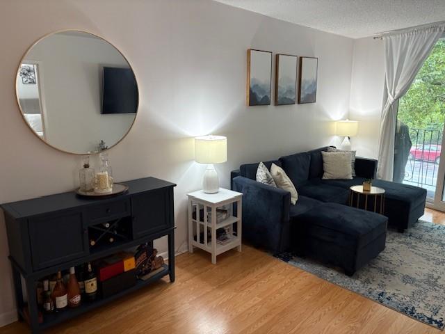 9971 Shore Road, Unit 9C Brooklyn, NY 11209 - Photo 5 of 9 a living room with furniture and a mirror