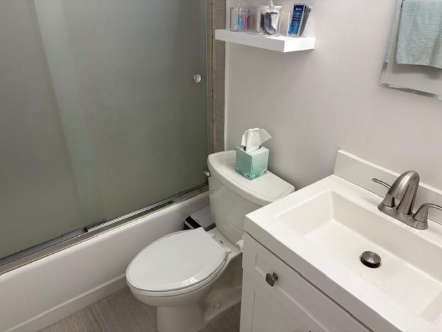 9971 Shore Road, Unit 9C Brooklyn, NY 11209 - Photo 7 of 9 a bathroom with a sink and a toilet