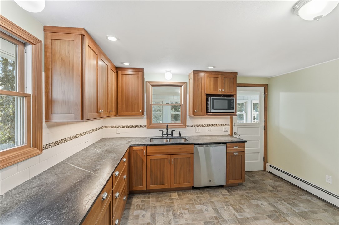382 Beavertail Road Jamestown, RI 02835 - Photo 11 of 31 Kitchen leading to sun porch!