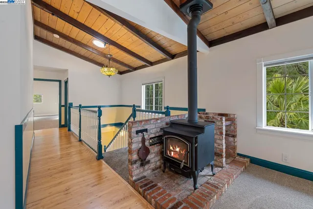 a view of workspace with wooden floor windows