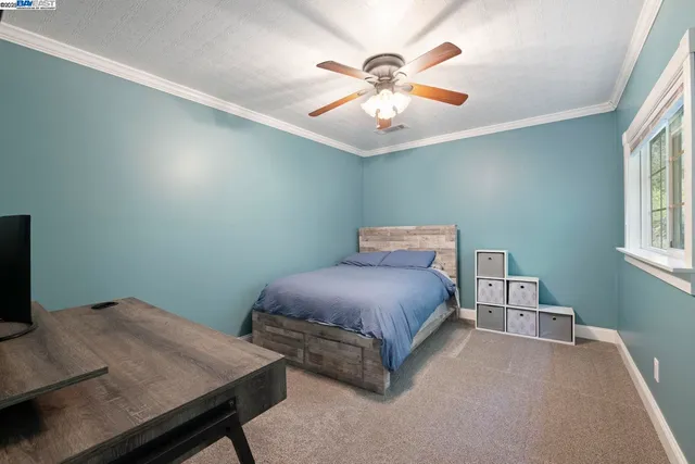 a view of backyard with deck and outdoor seating