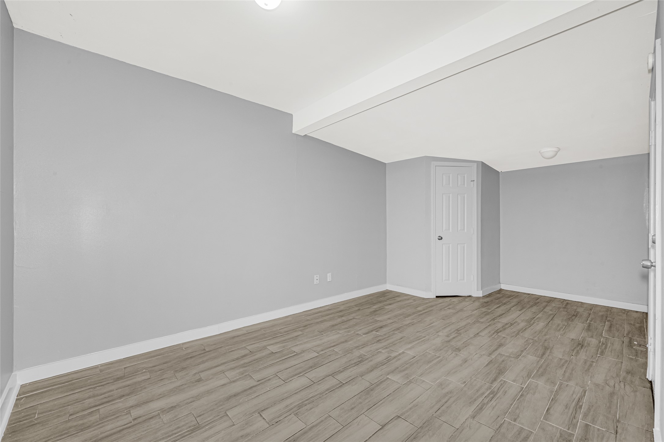 5009 Bataan Road Houston, TX 77033 - Photo 16 of 24 a view of an empty room with wooden floor