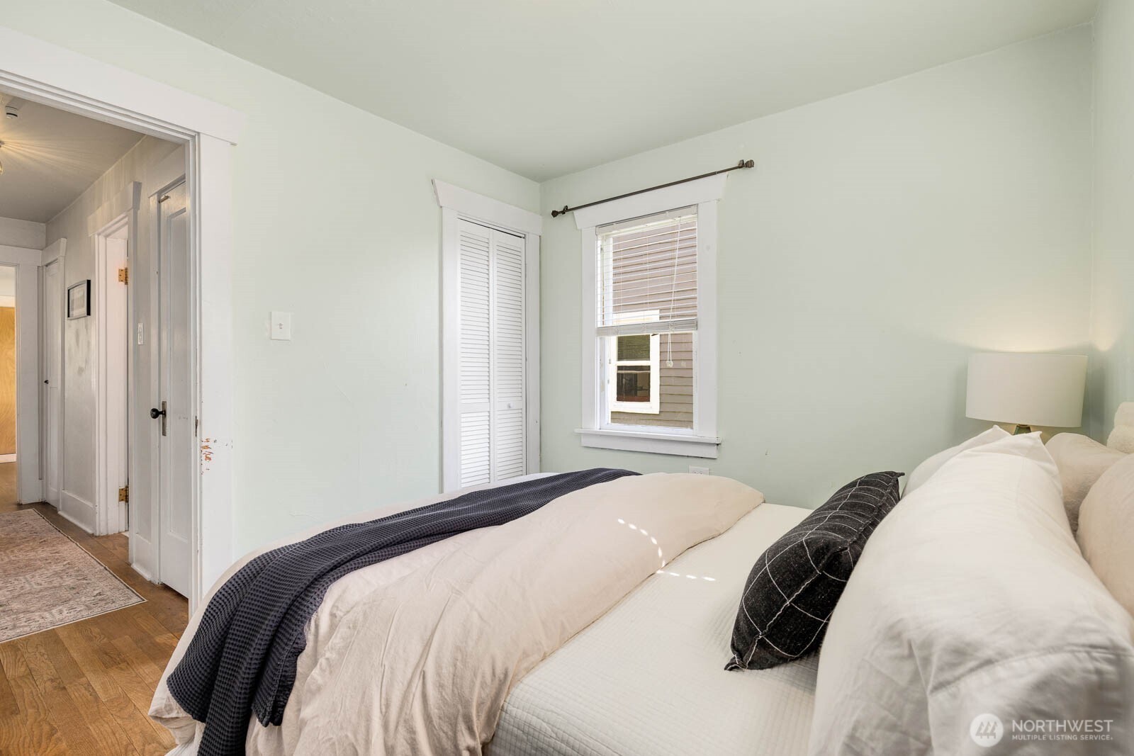 1002 South Adams Street Tacoma, WA 98405 - Photo 18 of 40 a bedroom with a bed and a window