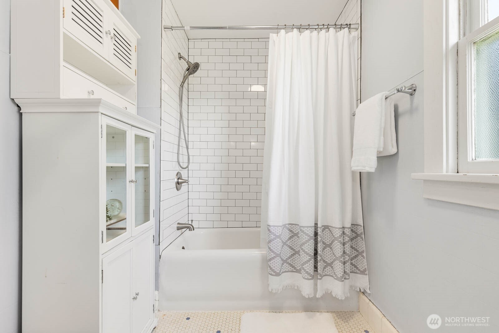 1002 South Adams Street Tacoma, WA 98405 - Photo 20 of 40 a bathroom with a bathtub and shower
