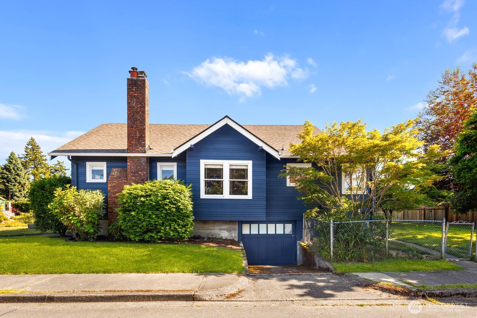 1002 South Adams Street Tacoma, WA 98405 - Photo 3 of 40 a front view of a house with garden