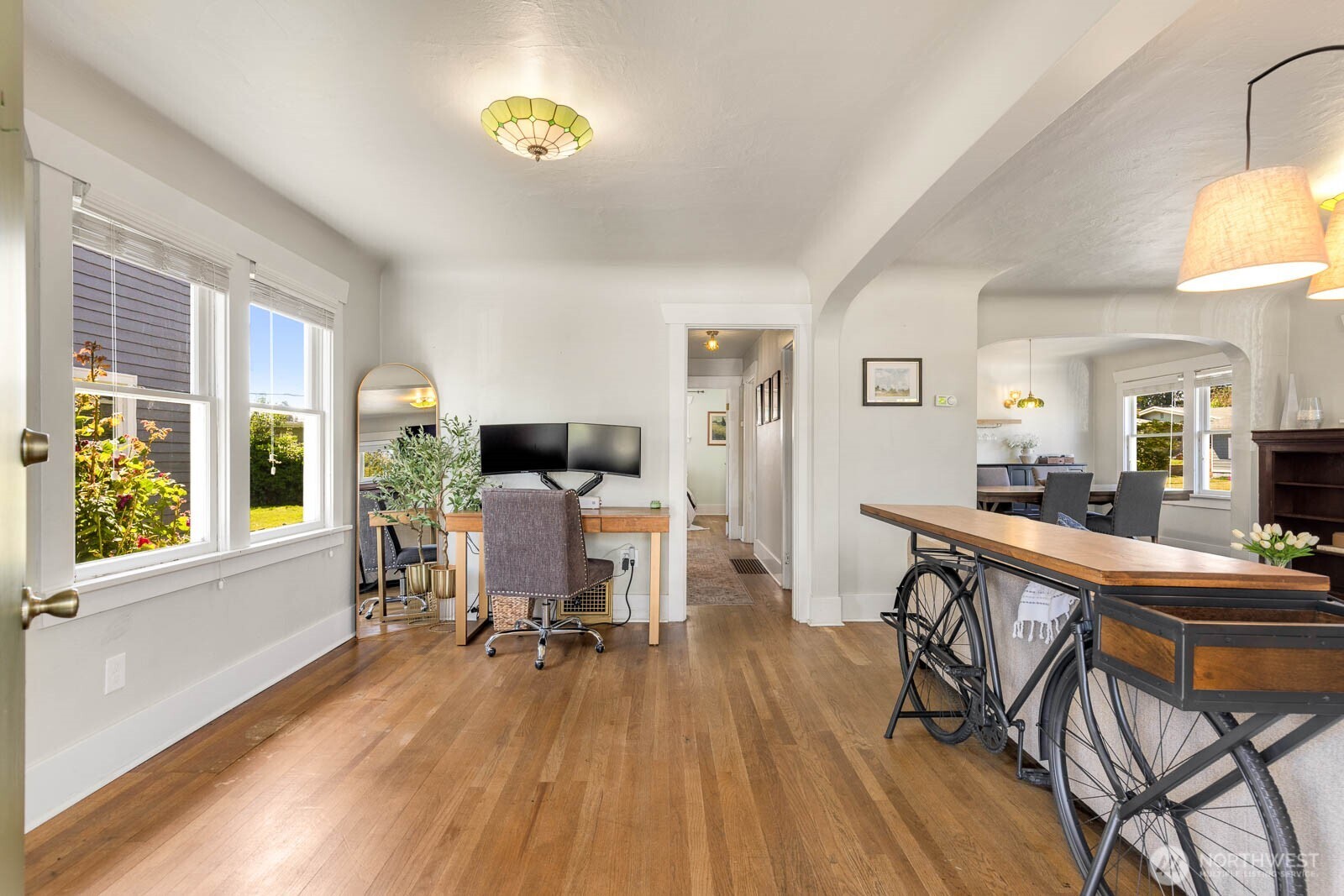 1002 South Adams Street Tacoma, WA 98405 - Photo 5 of 40 a view of a dining room with furniture window and wooden floor