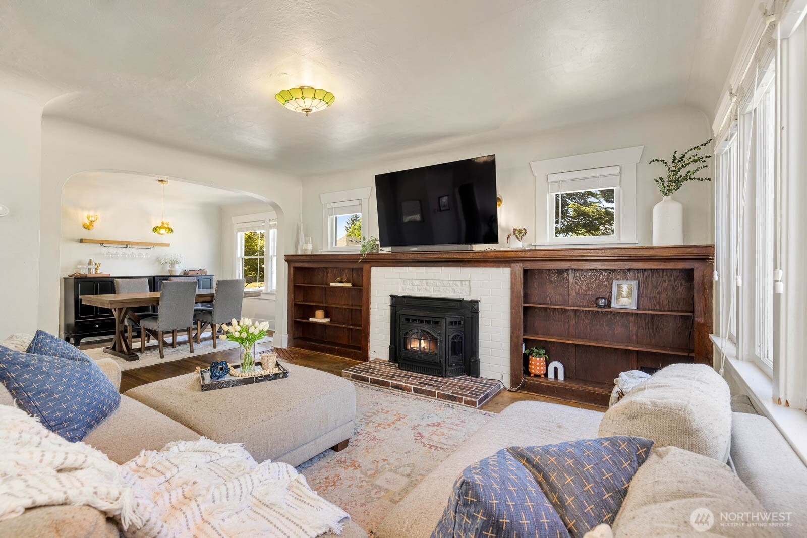 1002 South Adams Street Tacoma, WA 98405 - Photo 7 of 40 a living room with furniture and a fireplace