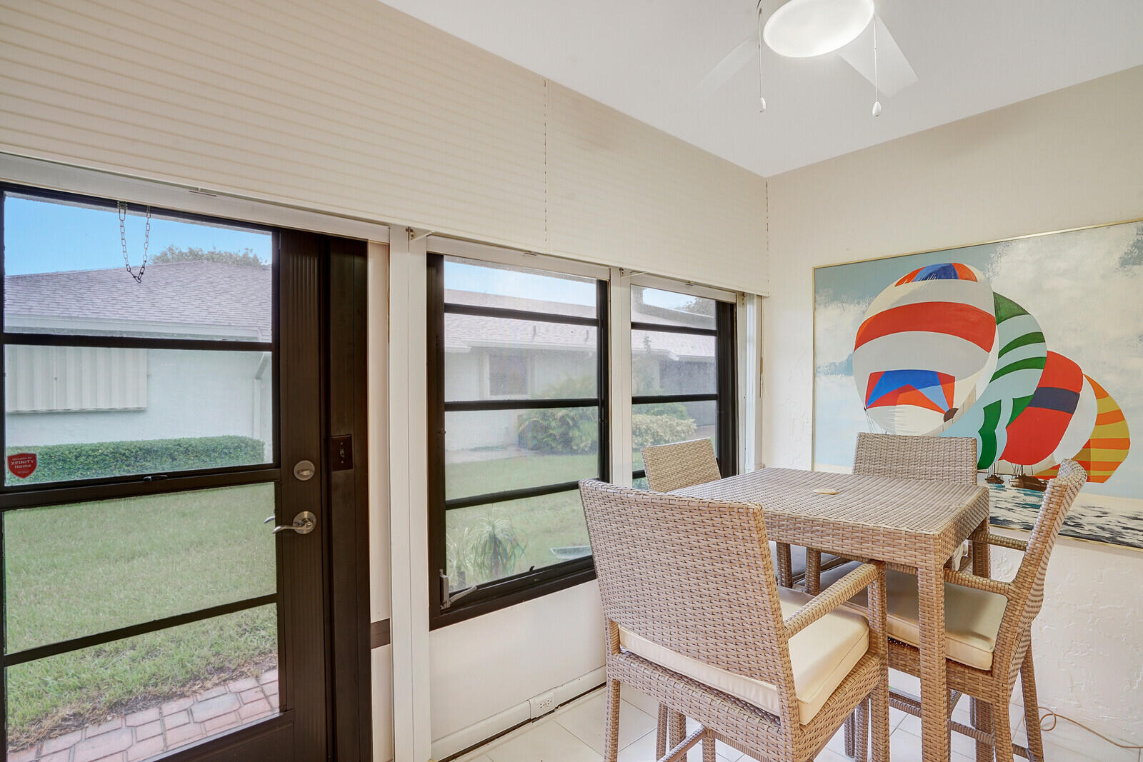 4180 Mango Tree Court, Unit B Boynton Beach, FL 33436 - Photo 14 of 25 a view of a dining room with furniture and a potted plant