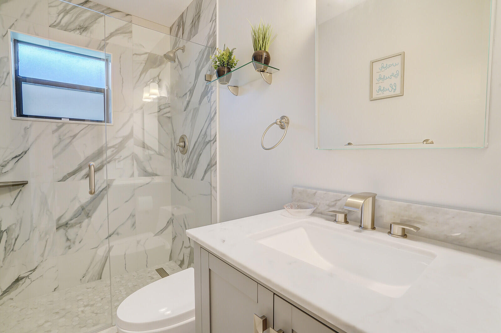 4180 Mango Tree Court, Unit B Boynton Beach, FL 33436 - Photo 19 of 25 a bathroom with a sink toilet and shower