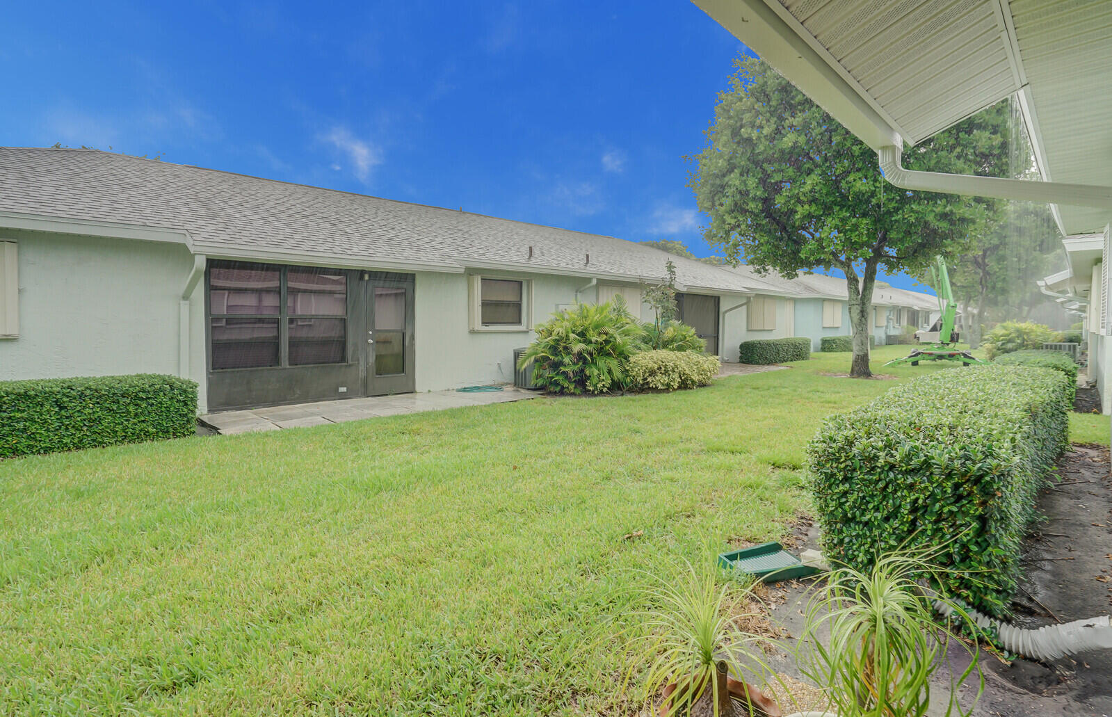 4180 Mango Tree Court, Unit B Boynton Beach, FL 33436 - Photo 25 of 25 a front view of a house with garden