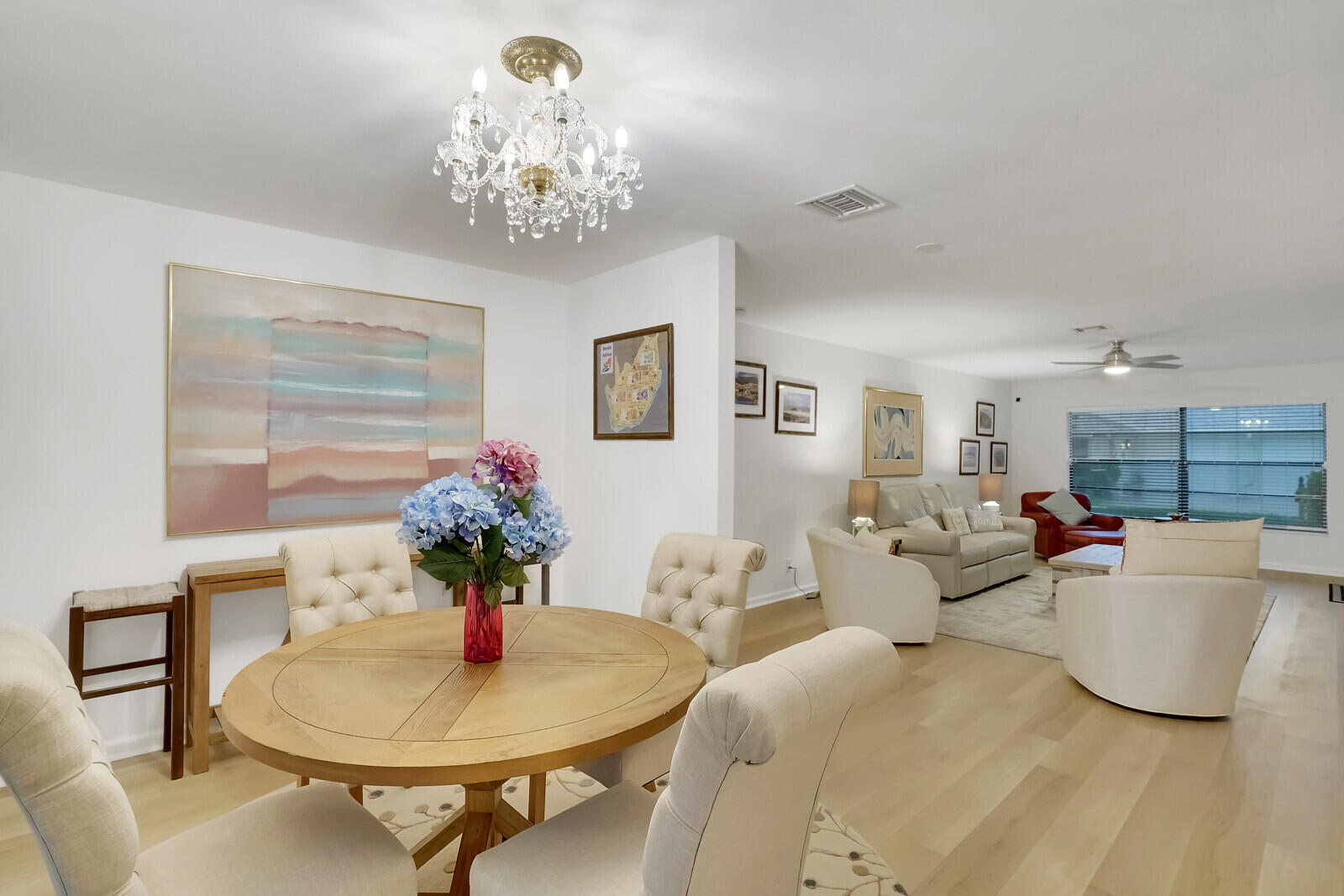 4180 Mango Tree Court, Unit B Boynton Beach, FL 33436 - Photo 3 of 25 a living room with furniture and a chandelier