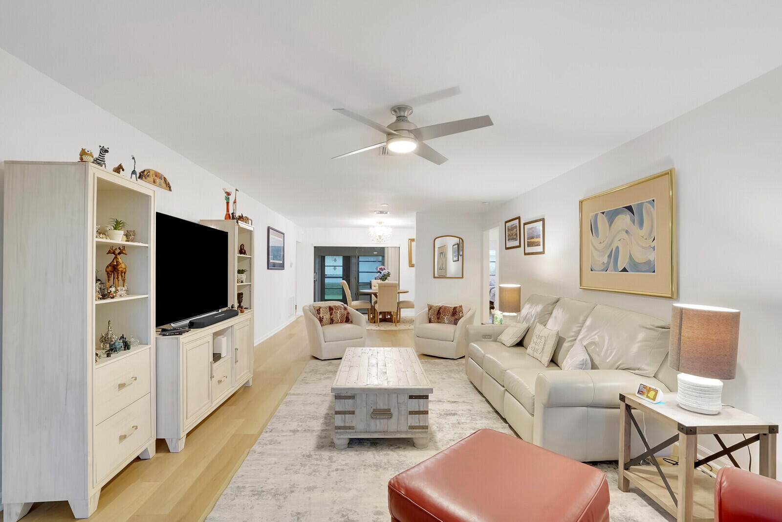 4180 Mango Tree Court, Unit B Boynton Beach, FL 33436 - Photo 4 of 25 a living room with furniture and a flat screen tv