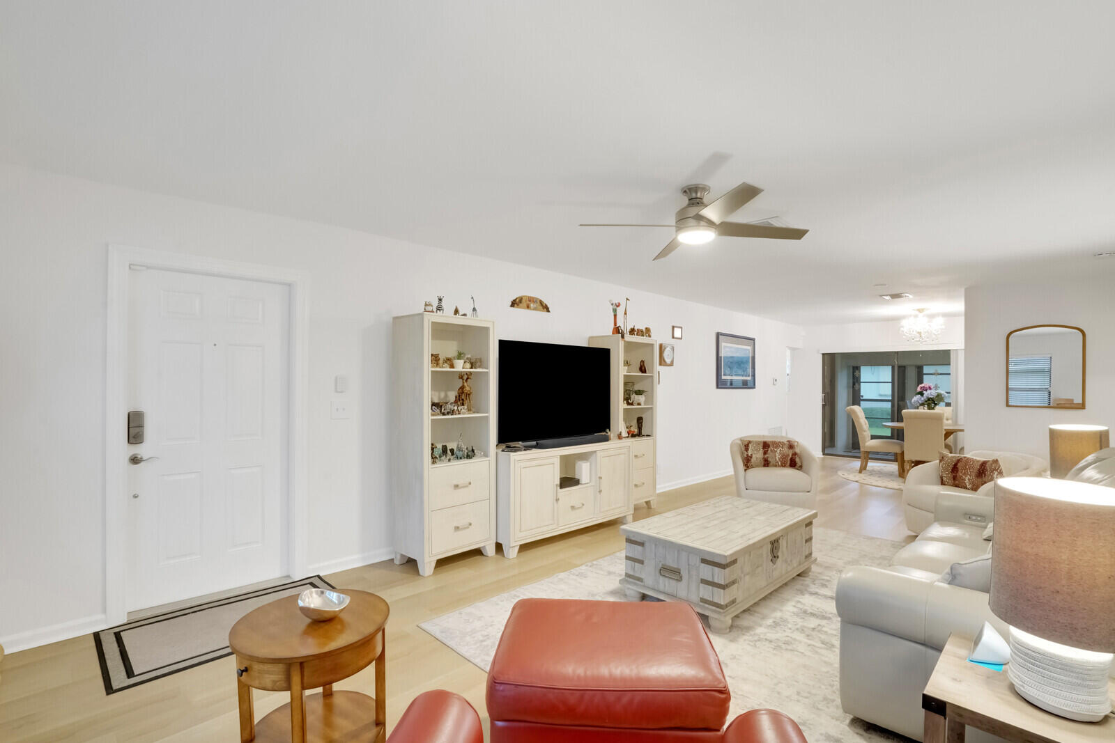 4180 Mango Tree Court, Unit B Boynton Beach, FL 33436 - Photo 6 of 25 a living room with furniture and a flat screen tv