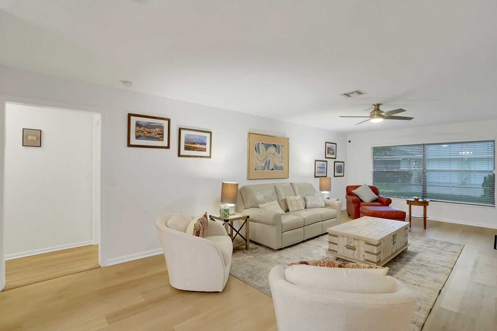 4180 Mango Tree Court, Unit B Boynton Beach, FL 33436 - Photo 7 of 25 a living room with furniture and wooden floor