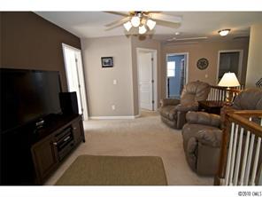 208 Sand Paver Way Fort Mill, SC 29708 - Photo 13 of 16 a living room with furniture and a flat screen tv