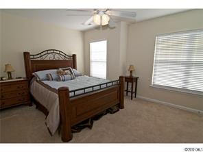 208 Sand Paver Way Fort Mill, SC 29708 - Photo 14 of 16 a bedroom with a bed and window