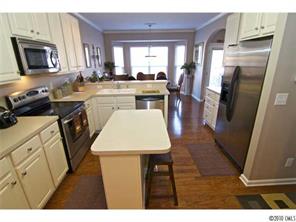 208 Sand Paver Way Fort Mill, SC 29708 - Photo 8 of 16 a open kitchen with a sink a microwave a stove and refrigerator