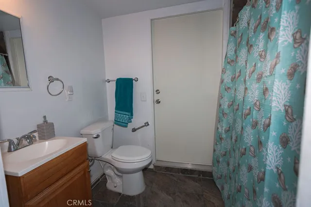 a bathroom with a toilet and a sink