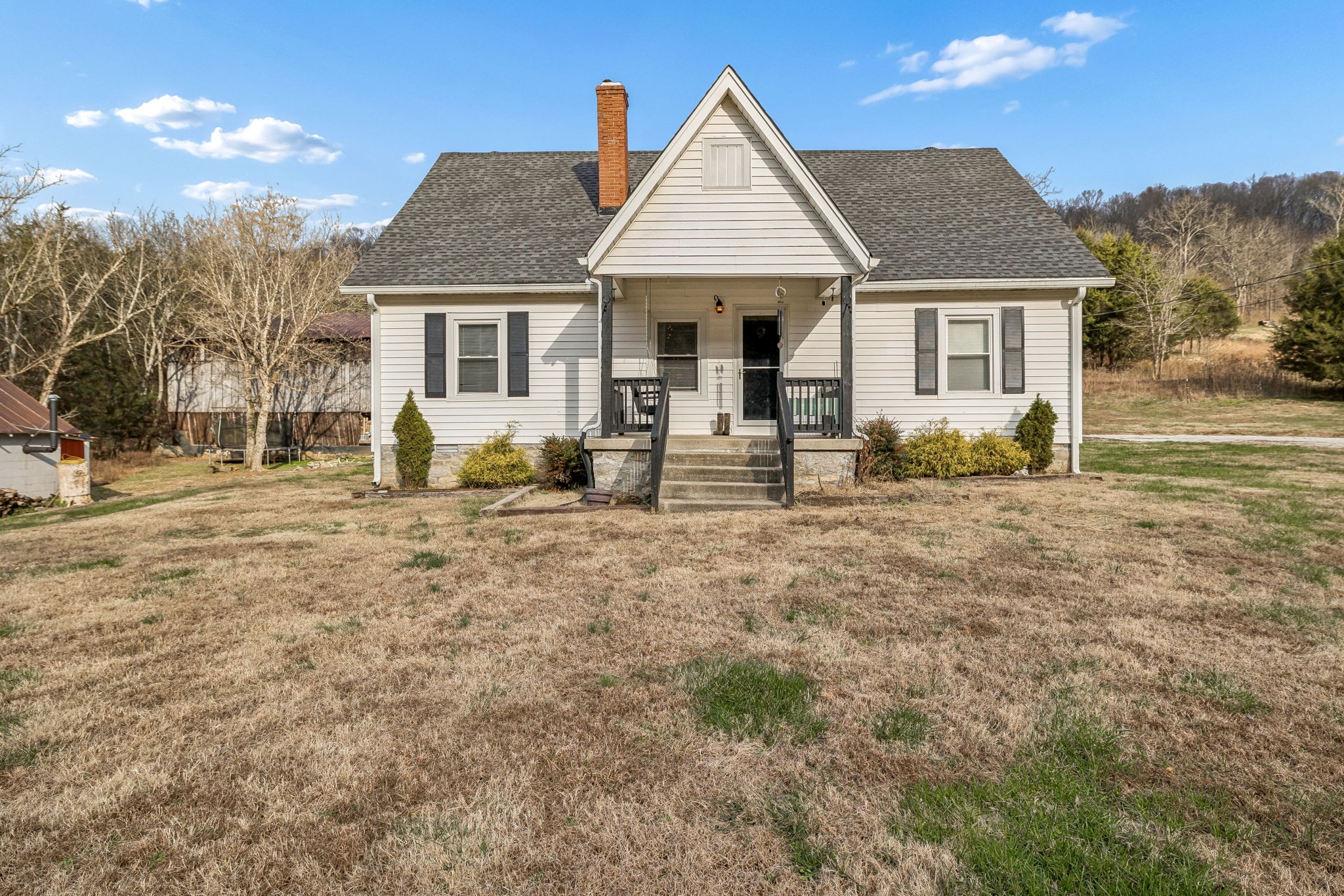 147 Sloan Branch Road Pleasant Shade, TN 37145 - Photo 2 of 53 a front view of a house with a yard