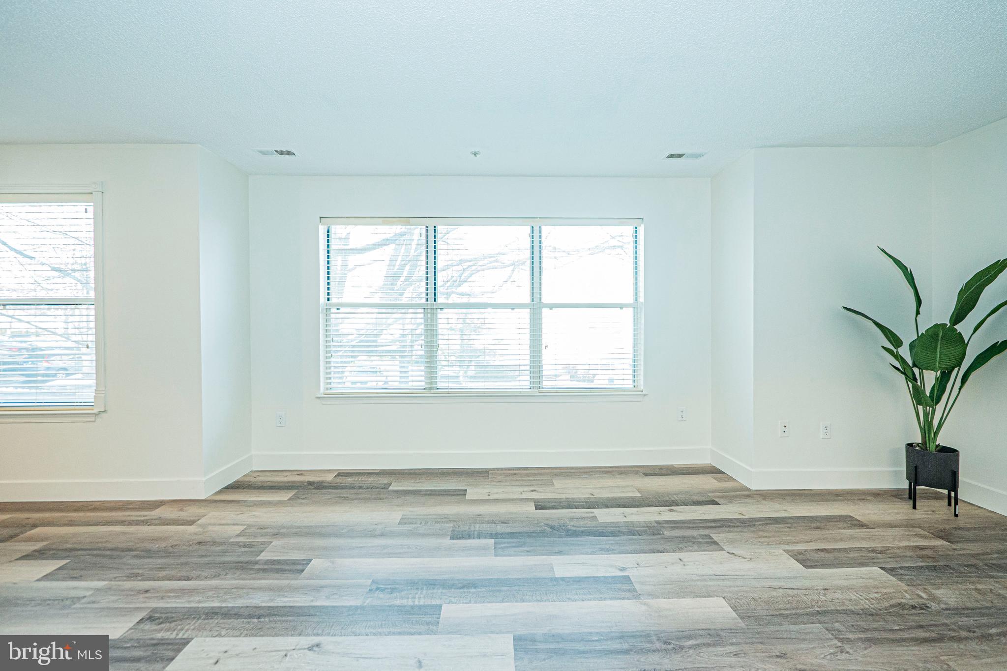 2600 Camelback Lane, Unit 6 Silver Spring, MD 20906 - Photo 21 of 40 a view of a room with wooden floor and window