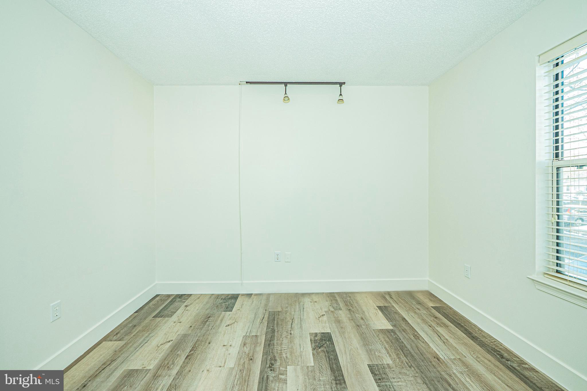 2600 Camelback Lane, Unit 6 Silver Spring, MD 20906 - Photo 29 of 40 a view of a room with wooden floor and small window
