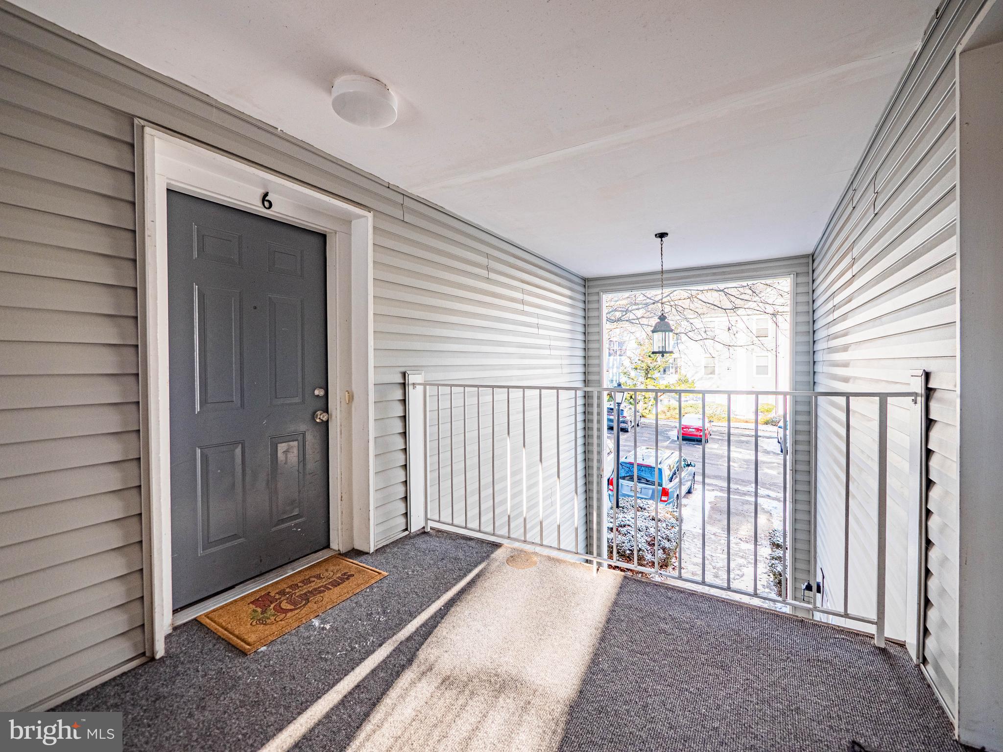 2600 Camelback Lane, Unit 6 Silver Spring, MD 20906 - Photo 3 of 40 a view of a bedroom with wooden floor and windows