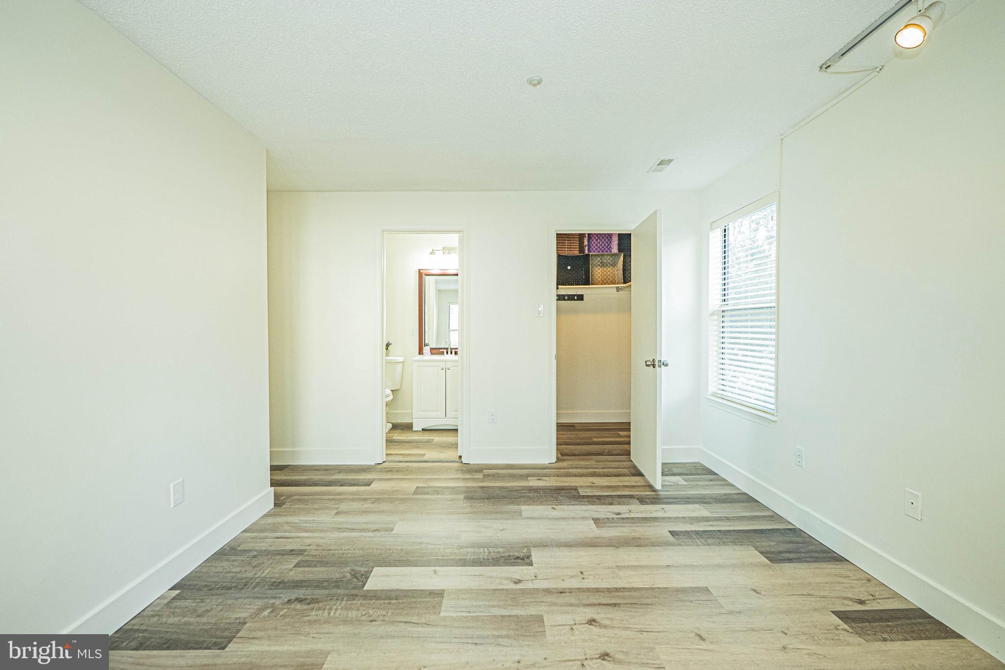 2600 Camelback Lane, Unit 6 Silver Spring, MD 20906 - Photo 31 of 40 a view of a livingroom with wooden floor and a window