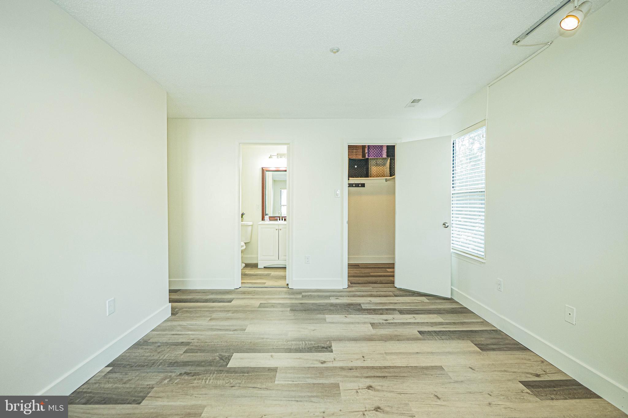 2600 Camelback Lane, Unit 6 Silver Spring, MD 20906 - Photo 38 of 40 a view of a livingroom with wooden floor and a bathroom