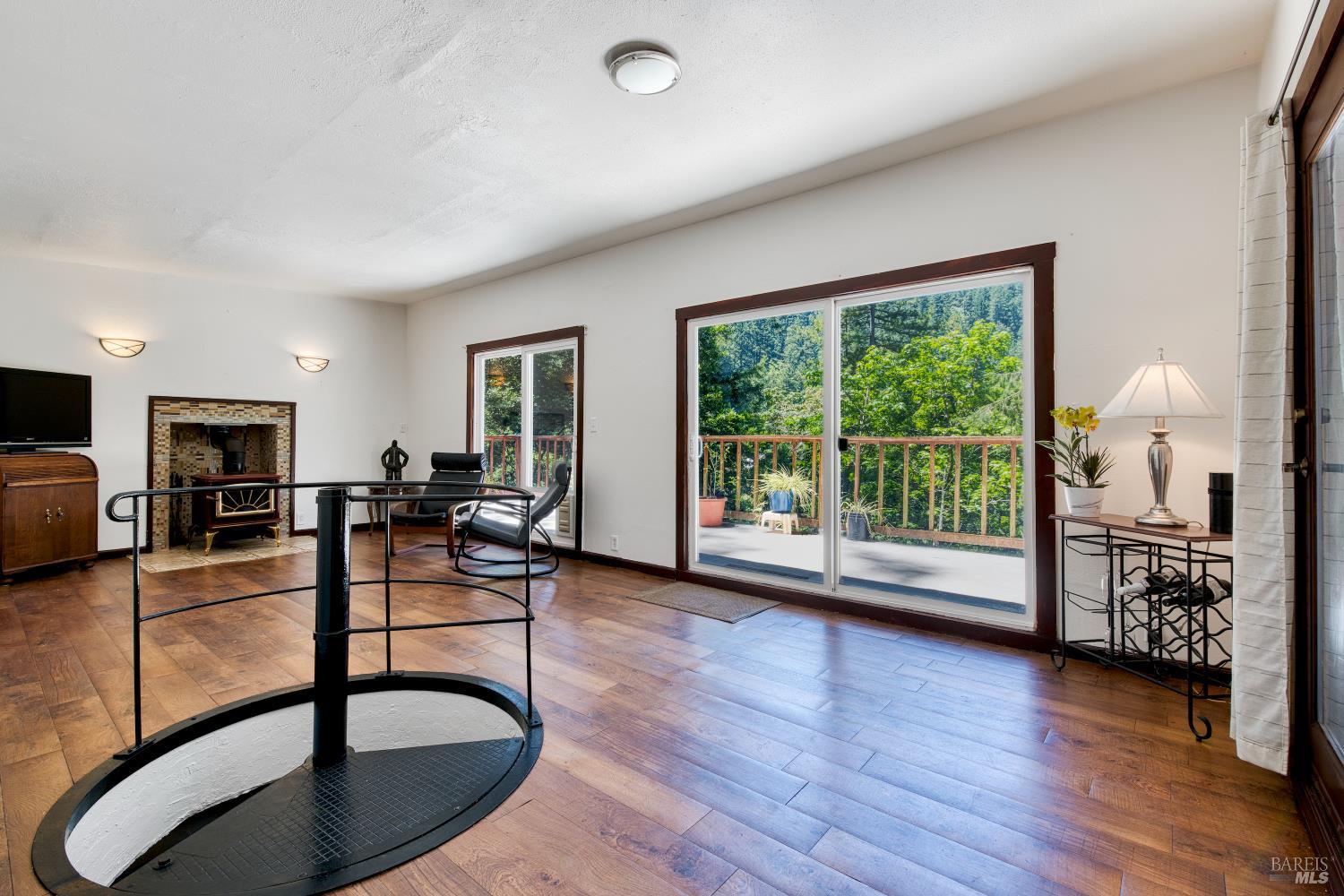 15 Mountain View Road Forest Knolls, CA 94933 - Photo 12 of 48 The foreground shows a spiral staircase leading down to the bedrooms
