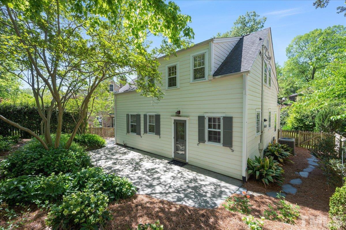 2511 Kenmore Drive Raleigh, NC 27608 - Photo 27 of 34 spacious back patio perfect for grilling and entertaining - surrounded by low maintenance english inspired gardens and flowers