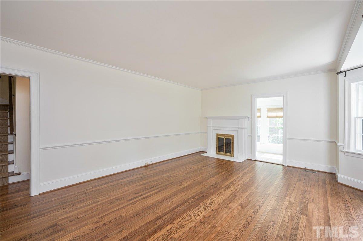 2511 Kenmore Drive Raleigh, NC 27608 - Photo 4 of 34 gleaming refinished hardwood floors throughout the home as well as newly installed sisal stair runner -