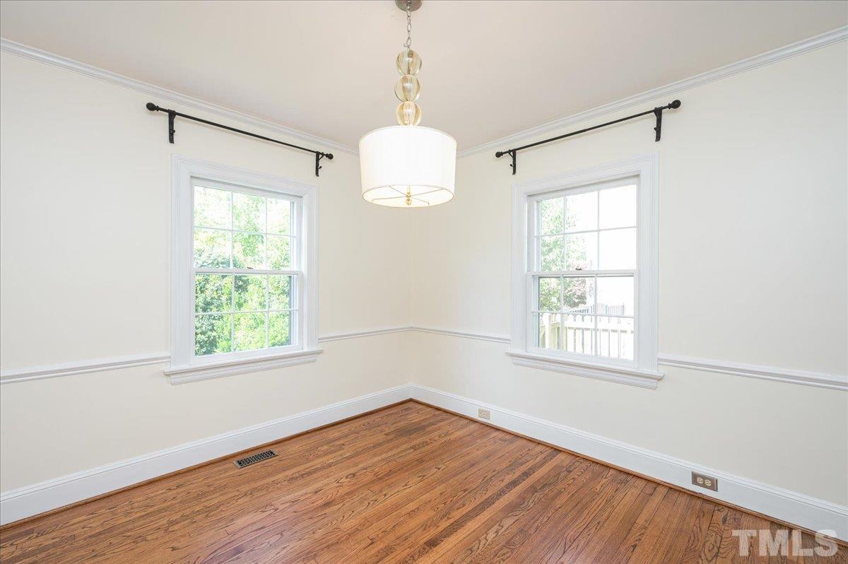 2511 Kenmore Drive Raleigh, NC 27608 - Photo 9 of 34 Access to bright white updated kitchen and living room