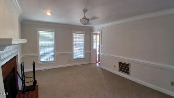 a view of an empty room with a window