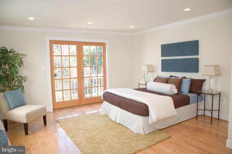 French doors open onto petite balcony.