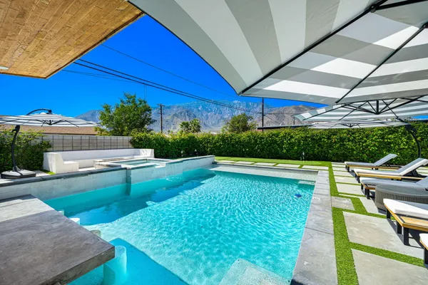 a view of a swimming pool with a patio