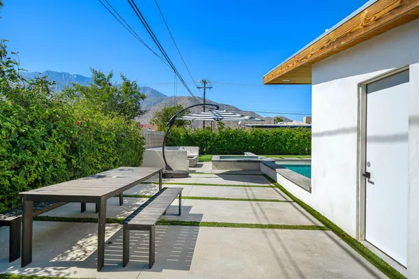 a view of swimming pool with seating space
