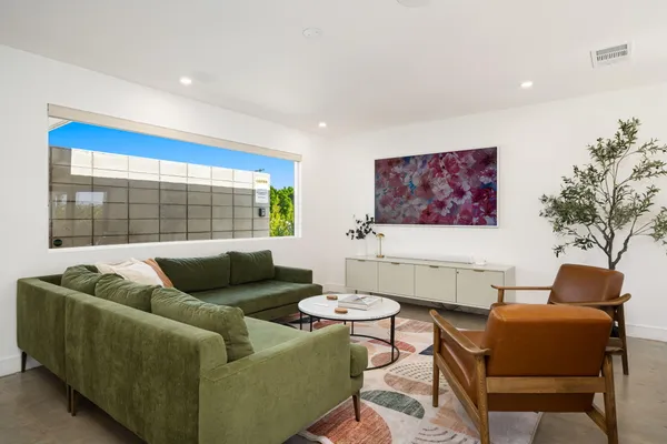 a living room with furniture and a large window