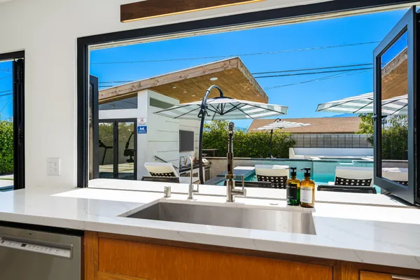 a kitchen with a sink and a counter top space