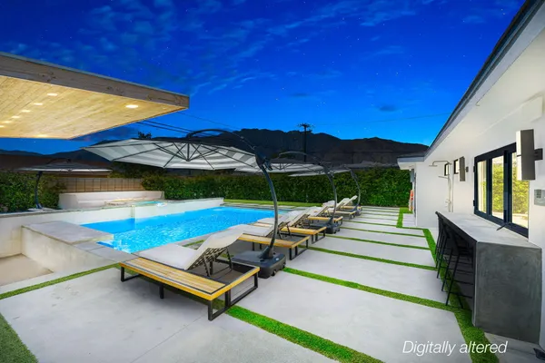a view of swimming pool with seating area