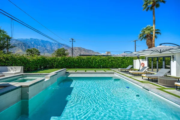 a view of a swimming pool with a patio