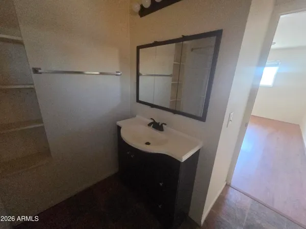 a bathroom with a sink and mirror
