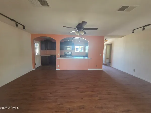 a view of a kitchen with a sink and a window