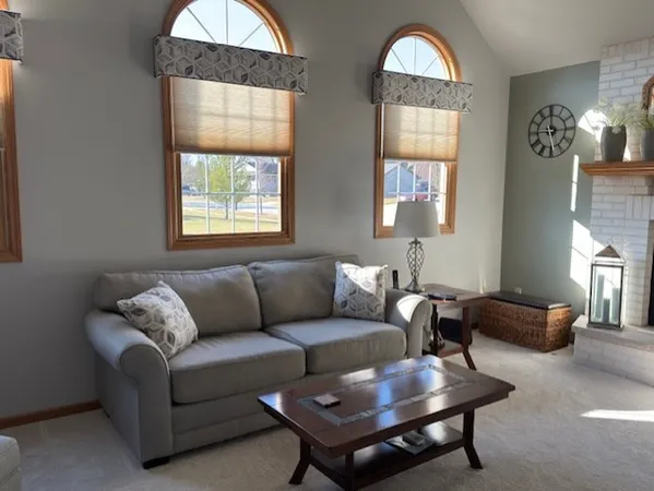 a living room with furniture and a window