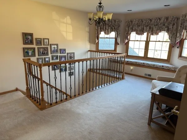 a view of a livingroom with furniture and a window